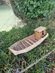 Wooden fishing boat model.